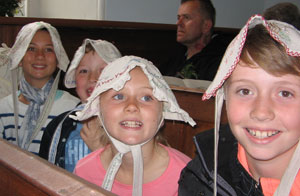 Harry Hunt's great grandchildren wearing bonnets.