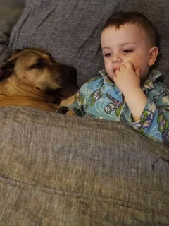 Miles Mann and doggy friend.