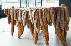 A table made from bread rolls, use it and eat it